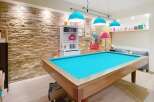 This stunning property boasts a unique entertainment space, perfect for hosting friends and family.