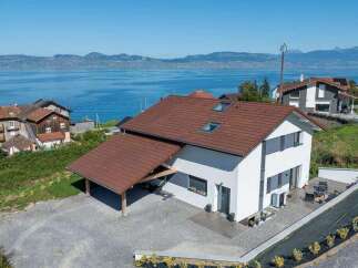 Discover your dream home with stunning lake views! This modern property boasts a sleek design, featuring a spacious layout and ample natural light.
