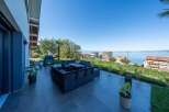Enjoy stunning views from this luxurious outdoor living space.