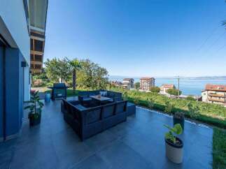 Enjoy stunning views from this luxurious outdoor living space.