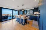 Experience luxury living in this stunning kitchen with breathtaking views.