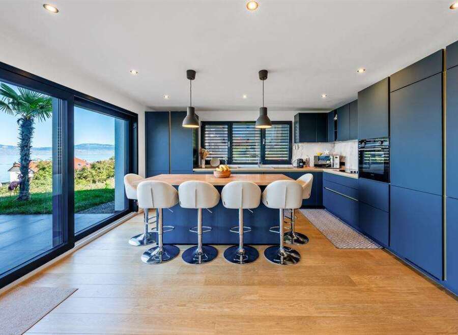 Experience luxury living in this stunning kitchen with a modern design.