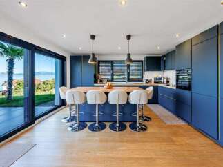 Experience luxury living in this stunning kitchen with a modern design.