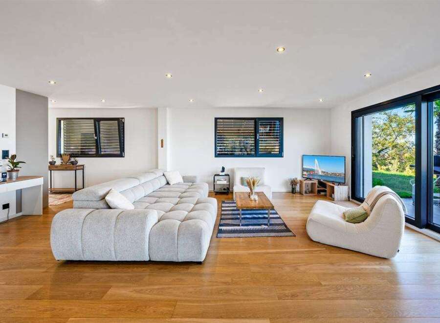 Experience modern luxury in this stunning living room.