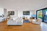 Experience modern luxury in this stunning living room.