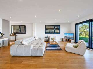 Experience modern luxury in this stunning living room.