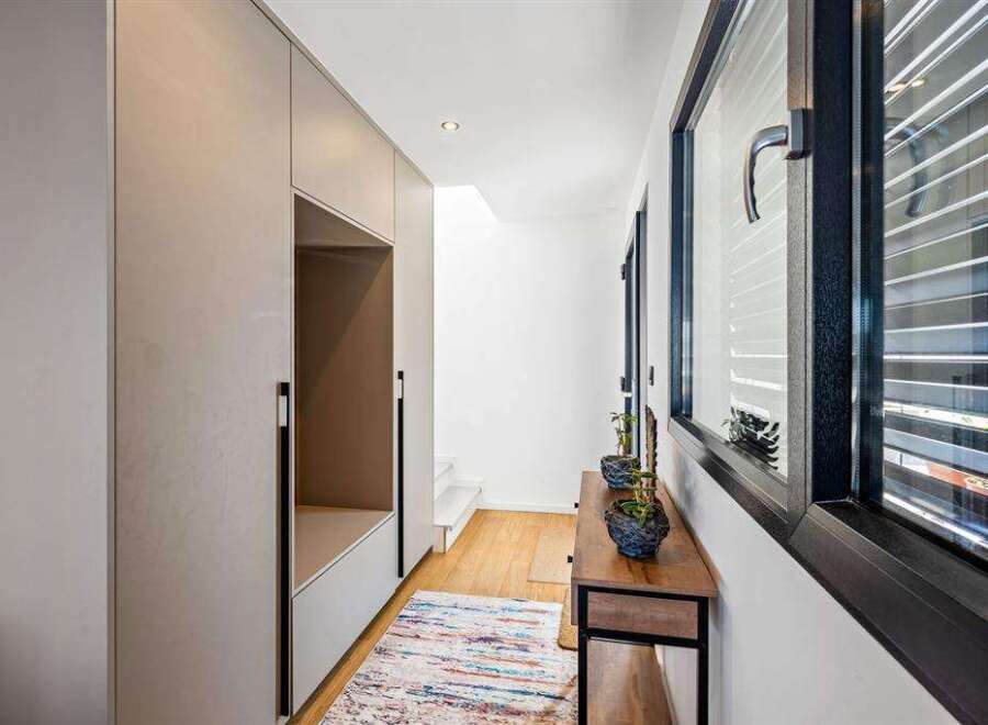This modern hallway boasts sleek design and functionality.