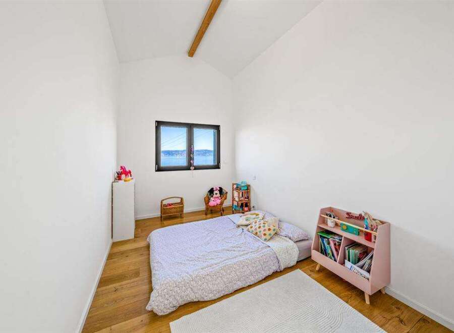 This charming bedroom offers a cozy and inviting atmosphere, perfect for a child's retreat.