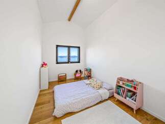 This charming bedroom offers a cozy and inviting atmosphere, perfect for a child's retreat.