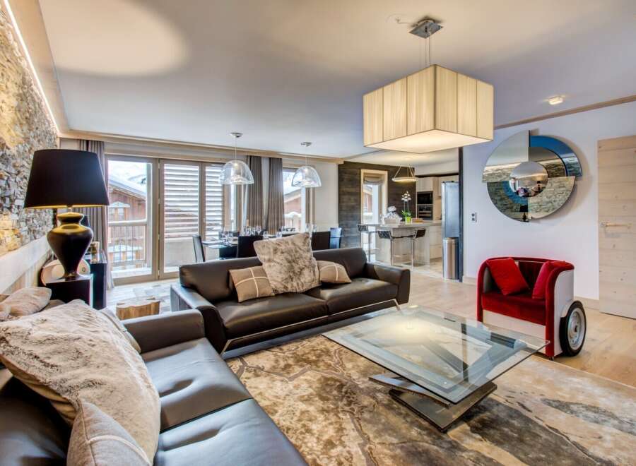 Experience luxury living in this stunning property, featuring a spacious living area with a modern design.