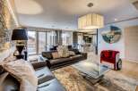 Experience luxury living in this stunning property, featuring a spacious living area with a modern design.
