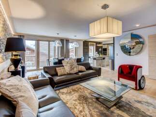 Experience luxury living in this stunning property, featuring a spacious living area with a modern design.