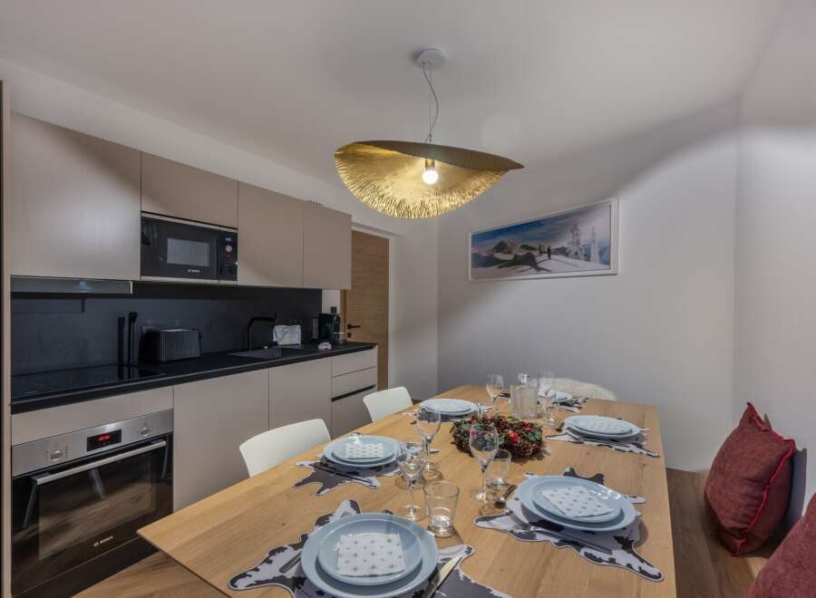 Experience modern living in this stylish property, featuring a well-equipped kitchen with sleek appliances and ample counter space.