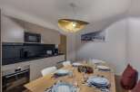 Experience modern living in this stylish property, featuring a well-equipped kitchen with sleek appliances and ample counter space.