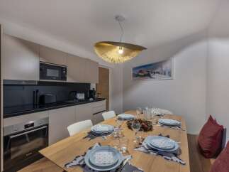 Experience modern living in this stylish property, featuring a well-equipped kitchen with sleek appliances and ample counter space.