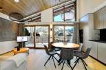 Experience luxury living in this stunning property, featuring a modern kitchen and a cozy living area.