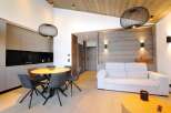 This modern apartment boasts a stylish open-plan living area, perfect for entertaining.