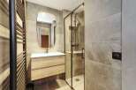 This modern bathroom boasts a sleek design with a focus on functionality and style.