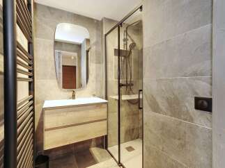This modern bathroom boasts a sleek design with a focus on functionality and style.
