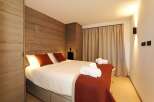 Experience luxury and comfort in this beautifully designed bedroom.