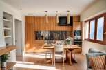 This stunning kitchen boasts modern design with custom wooden cabinetry and stainless steel accents.