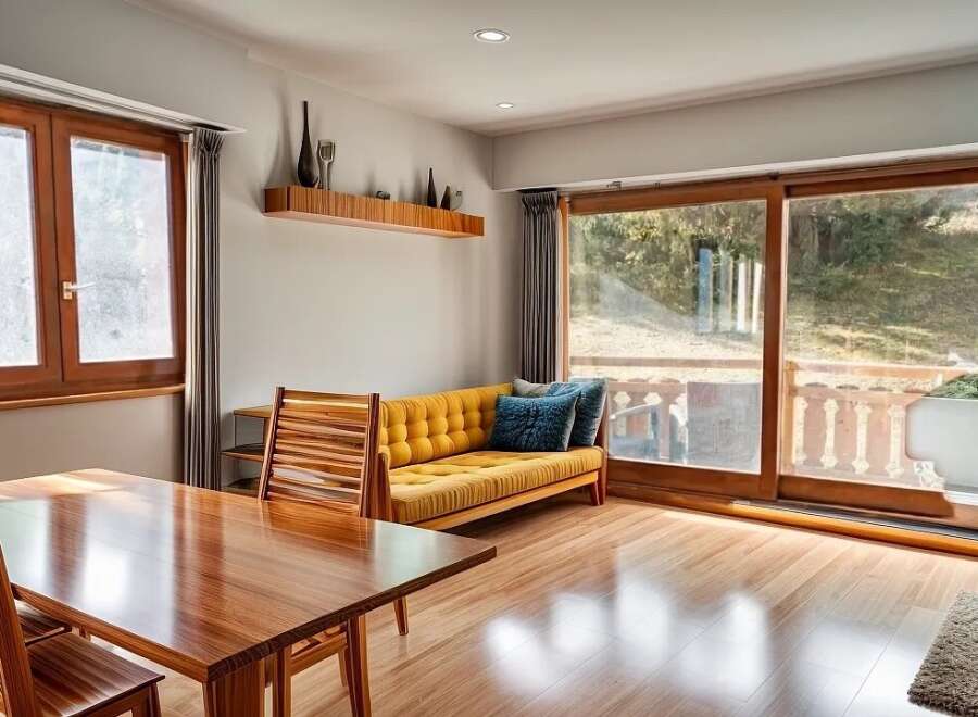 Step into this inviting living space, featuring a warm, wooden dining table perfect for gatherings.