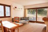 This charming property features a cozy living space with a comfortable daybed, perfect for relaxation.