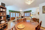 Step into this charming living space, perfect for relaxation and entertaining.