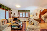 Step into a cozy living space filled with charm and character.