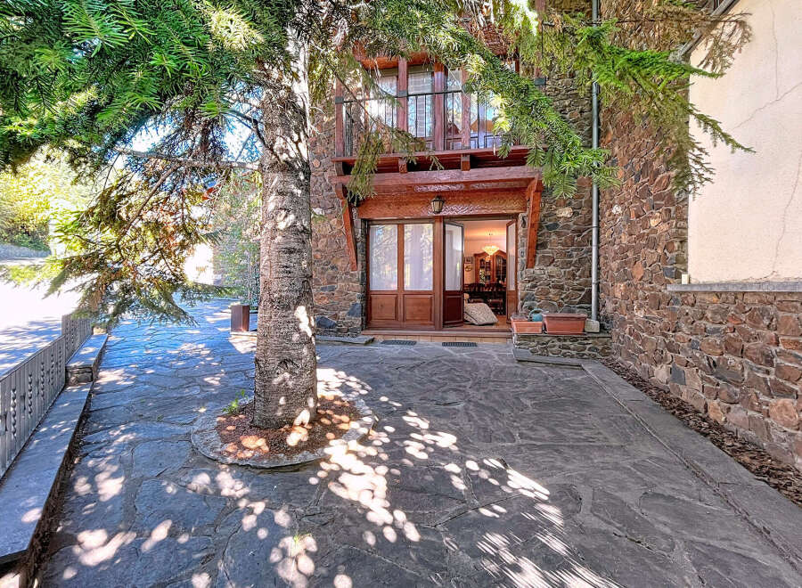 Discover the charm of this stunning property, featuring a beautiful stone facade and a welcoming entrance.