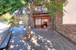 Discover the charm of this stunning property, featuring a beautiful stone facade and a welcoming entrance.