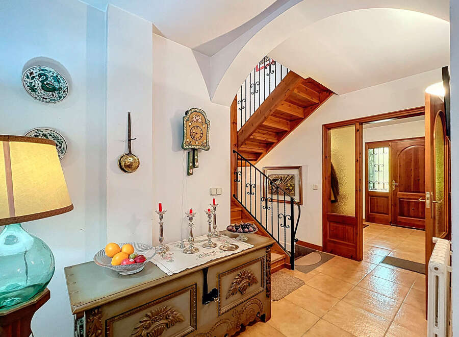 Step into this inviting entryway, showcasing a blend of rustic charm and timeless elegance.