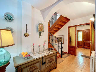 Step into this inviting entryway, showcasing a blend of rustic charm and timeless elegance.