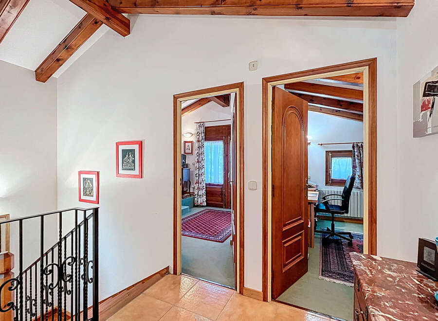 Discover the charm of this inviting property, featuring a bright hallway with access to multiple rooms.