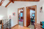 Discover the charm of this inviting property, featuring a bright hallway with access to multiple rooms.