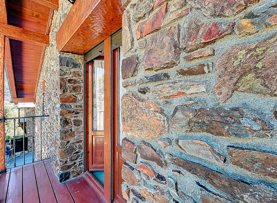 This stunning property boasts a unique stone facade, exuding rustic charm and character.