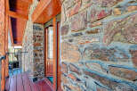 This stunning property boasts a unique stone facade, exuding rustic charm and character.
