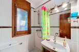 Discover this charming bathroom featuring a bright and airy design.