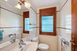 This charming bathroom features a bright and airy design, perfect for starting your day.