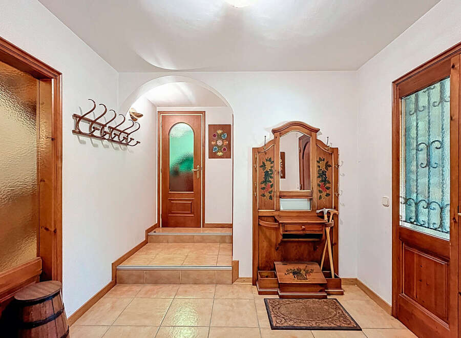 Step into a charming entryway with a touch of rustic elegance.
