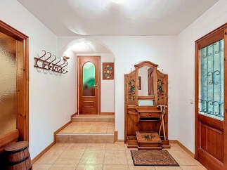 Step into a charming entryway with a touch of rustic elegance.