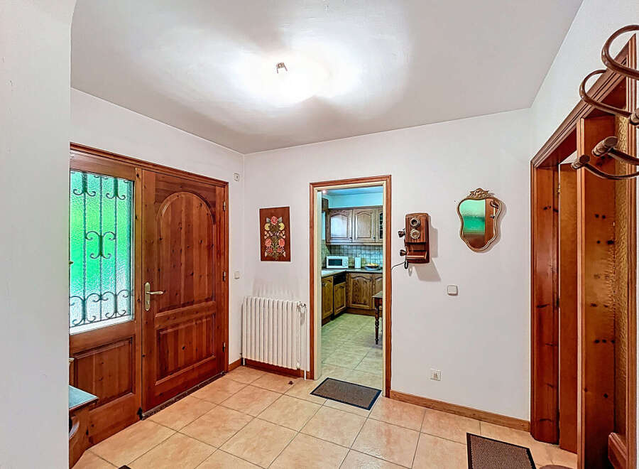Step into this inviting entryway, showcasing a warm and welcoming atmosphere.