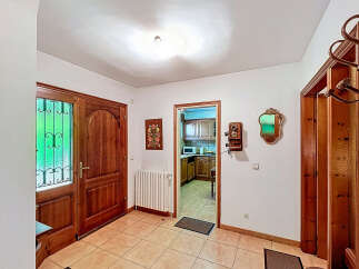 Step into this inviting entryway, showcasing a warm and welcoming atmosphere.