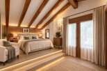 Experience rustic charm and modern comfort in this beautifully appointed bedroom, featuring exposed wooden beams and warm ambient lighting.