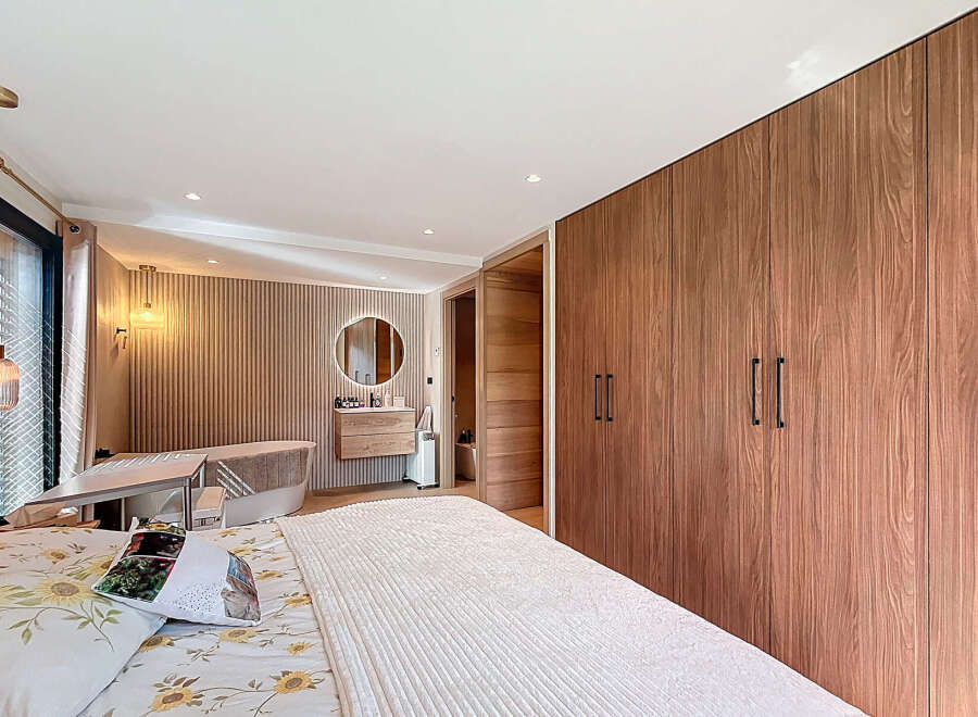 Step into luxury with this stunning bedroom featuring a modern design and elegant finishes.