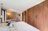 Step into luxury with this stunning bedroom featuring a modern design and elegant finishes.