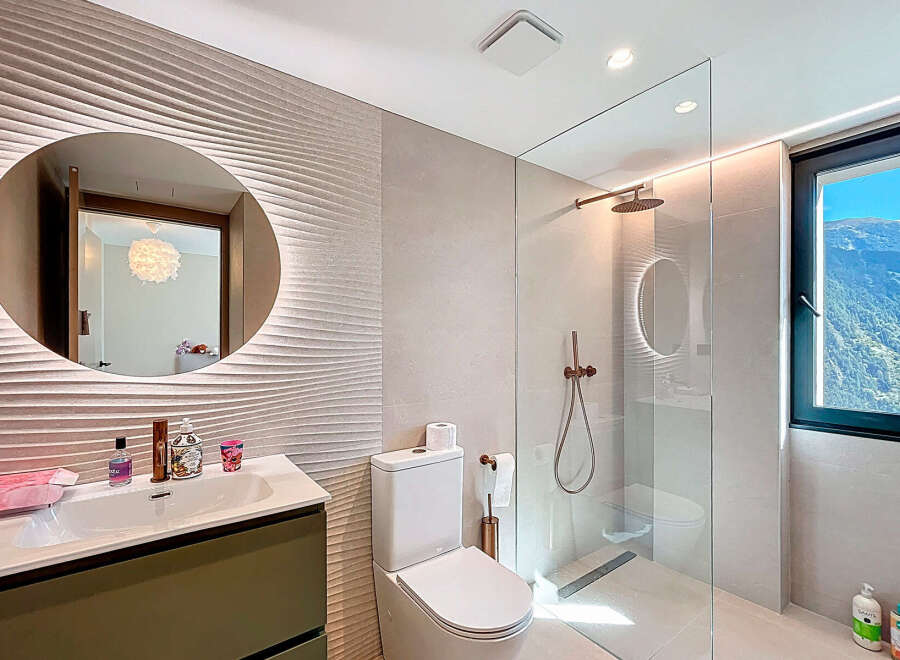 Step into luxury with this stunning bathroom featuring a modern design and high-end finishes.