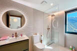 Step into luxury with this stunning bathroom featuring a modern design and high-end finishes.
