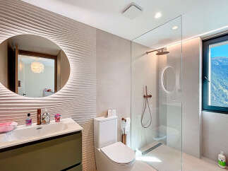 Step into luxury with this stunning bathroom featuring a modern design and high-end finishes.