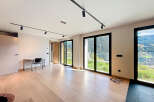 Experience luxury living in this stunning property, featuring expansive windows that frame breathtaking mountain views.
